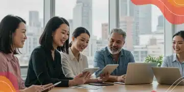 Voluntary Benefits 2025: A Deep Dive into What's Available and Why it Matters Employees reviewing diverse voluntary benefits options on digital devices in a collaborative office environment.