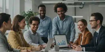Group engaged in financial planning discussion with laptops and charts